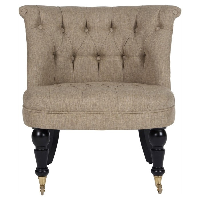 Açık kahverengi keten kapitoneli mini berjer, siyah ayakları ve tekerlekleriyle şık oturma alanları için ideal.