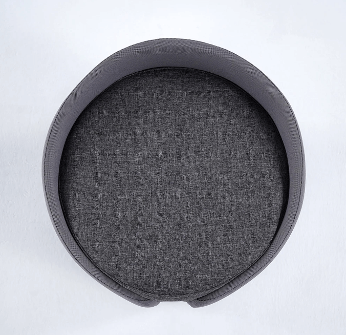 Gri keten kumaşlı yuvarlak mini puf, ergonomik tasarımı ile ev ve ofis kullanımına uygun.