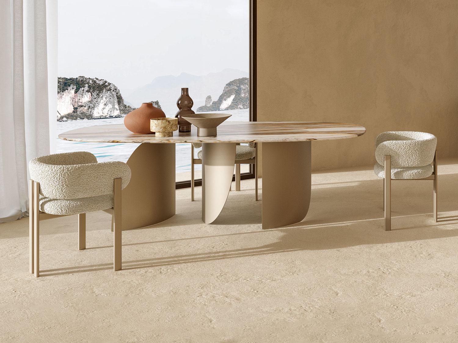 Modern dining table with unique design, surrounded by comfortable cream-colored chairs in a stylish interior setting.