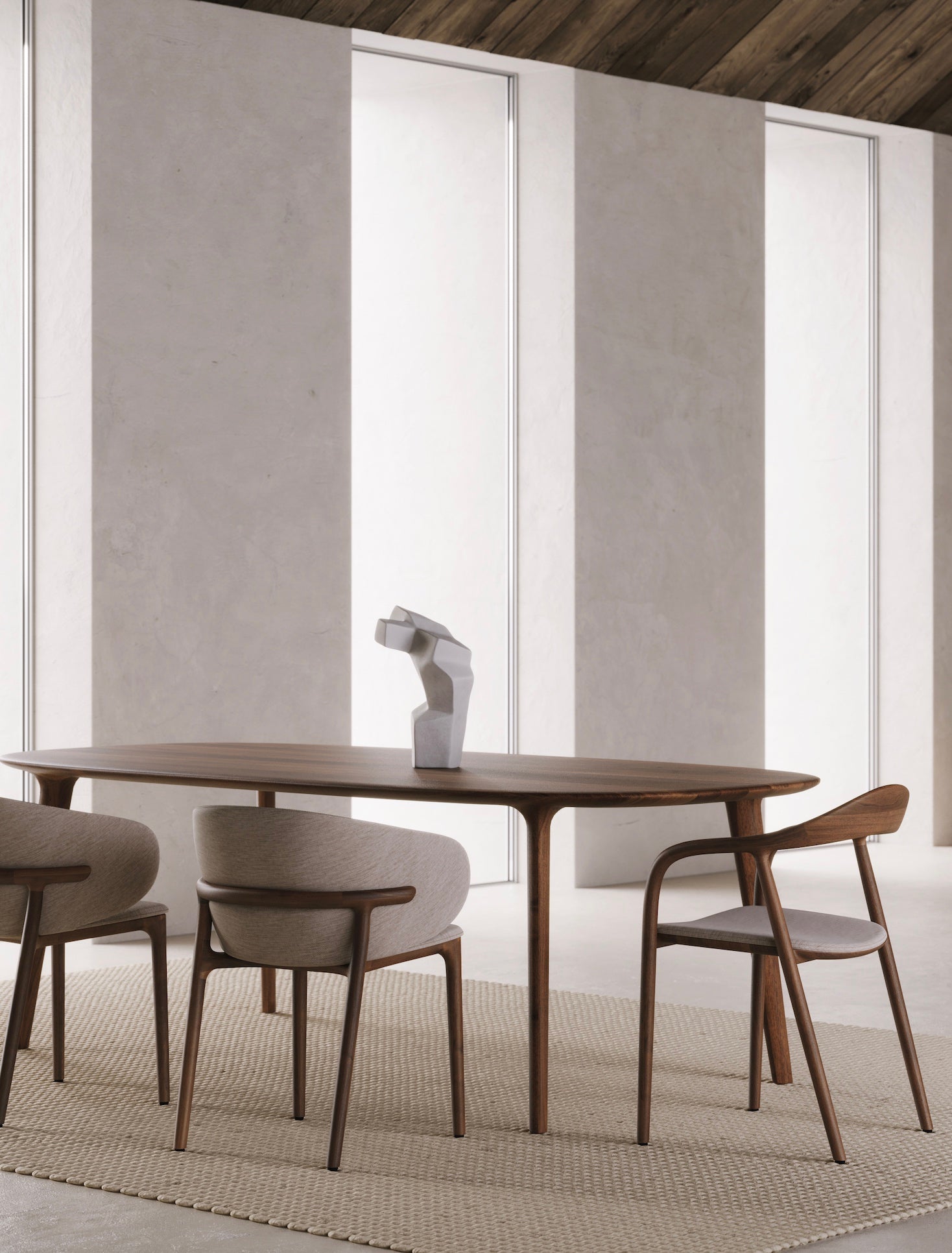 Modern dining room featuring a wooden table and stylish upholstered chairs, highlighting a minimalist decor.