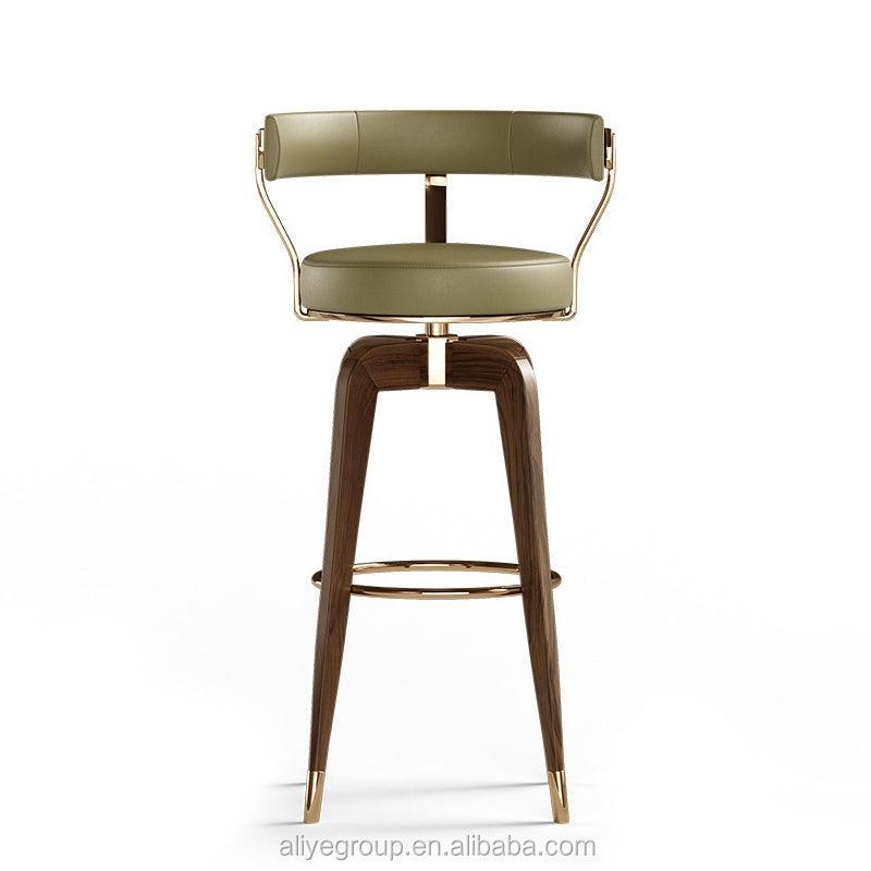 Yeşil suni deri, ahşap ayaklı, pirinç detaylı modern bar sandalyesi, 54x48x105 cm, oturum yüksekliği 85 cm.