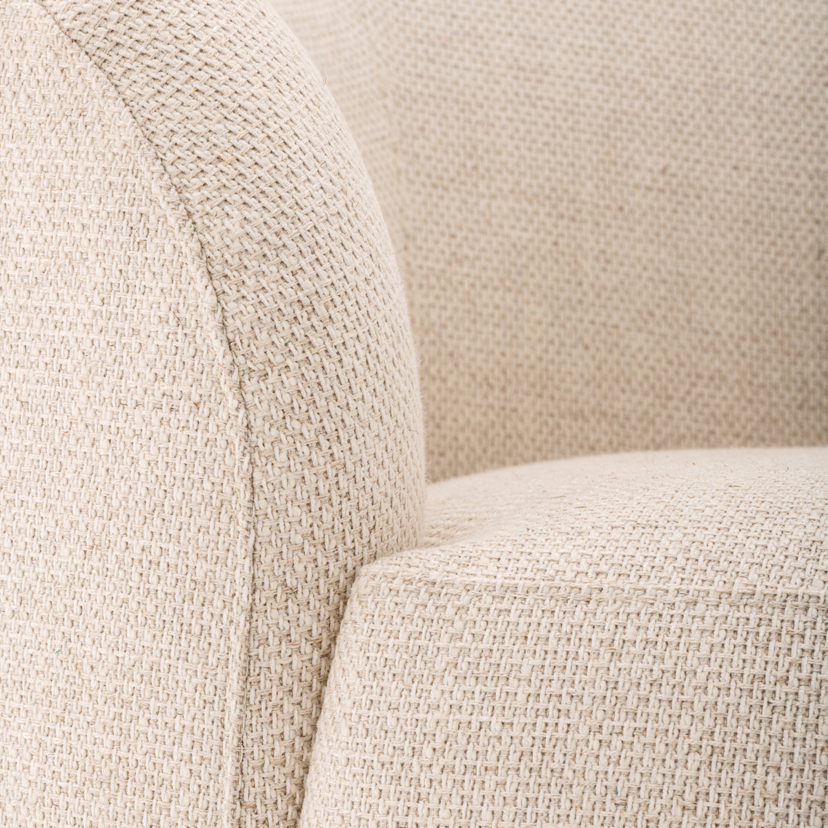 Close-up of Bernd Krem fabric on an oval bean-shaped sofa, showcasing the soft texture and elegant design.