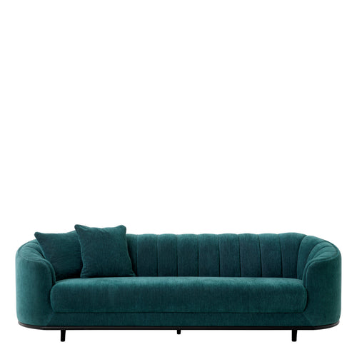 Yeşil şönil kumaşlı, ahşap ayaklı, dilimli detaylı kanepe sofa, iki yastık ile birlikte.