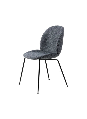 Beetle blue velvet upholstered chair with metal legs, elegant design, suitable for modern interiors.