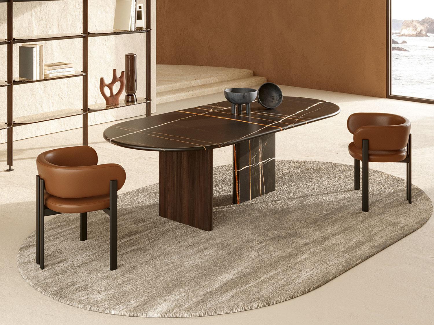 Modern dining room with a stylish table and Mailea Taba chairs featuring leather seats in a warm, earthy setting.